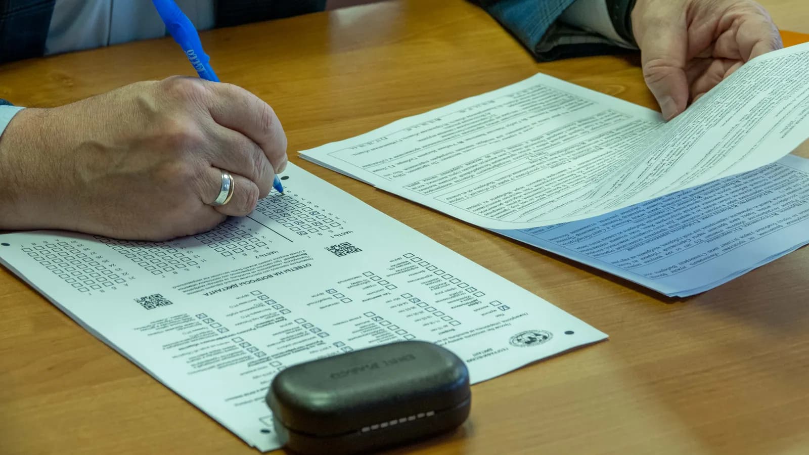 Business owner completing administrative documents with a pen